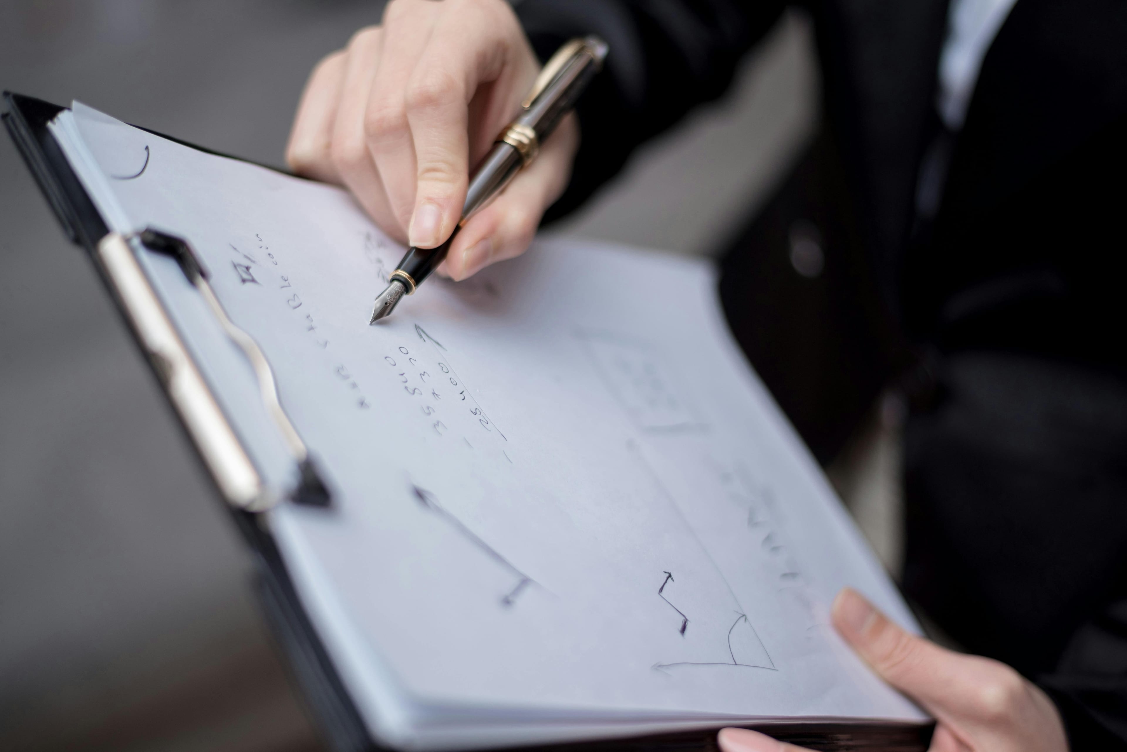 Elegant desk and hand writing — a considered intake